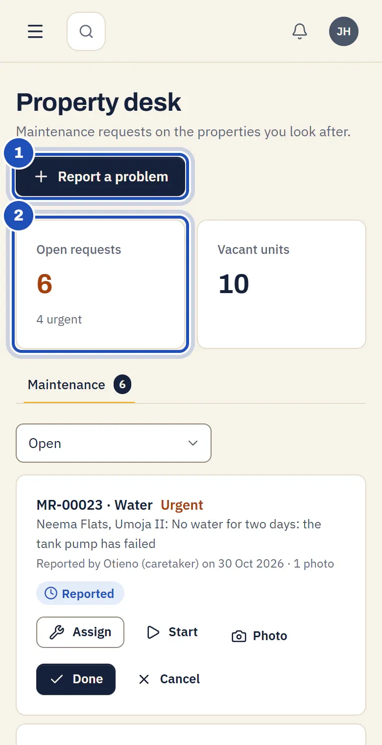 Juma Hamisi's Property desk on his phone: Report a problem (1) and the open requests with the number urgent (2), above the list of maintenance requests.